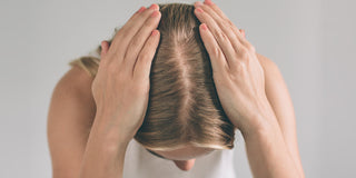 Woman checking for hair loss