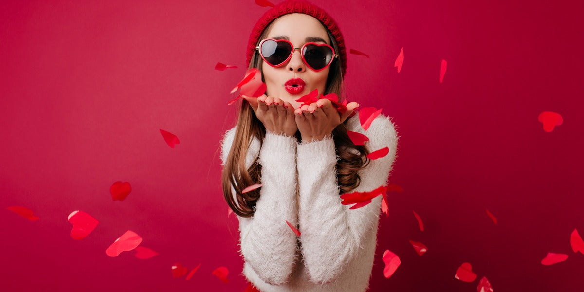 Lady surrounded by hears, blowing kisses on valentines day