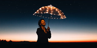 Lady holding umbrella with lights representing Seasonal Affective Disorder (SAD)