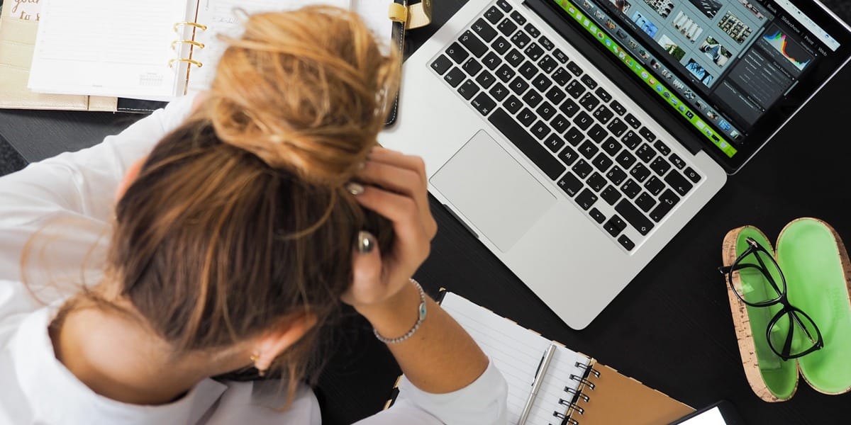 Lady stressed whilst working which is causing hair loss